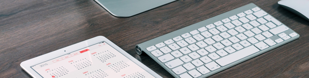 Keyboard and Ipad with dates on a wooden surface, highlighting that MD Accounting offers Personal Taxes Accounting